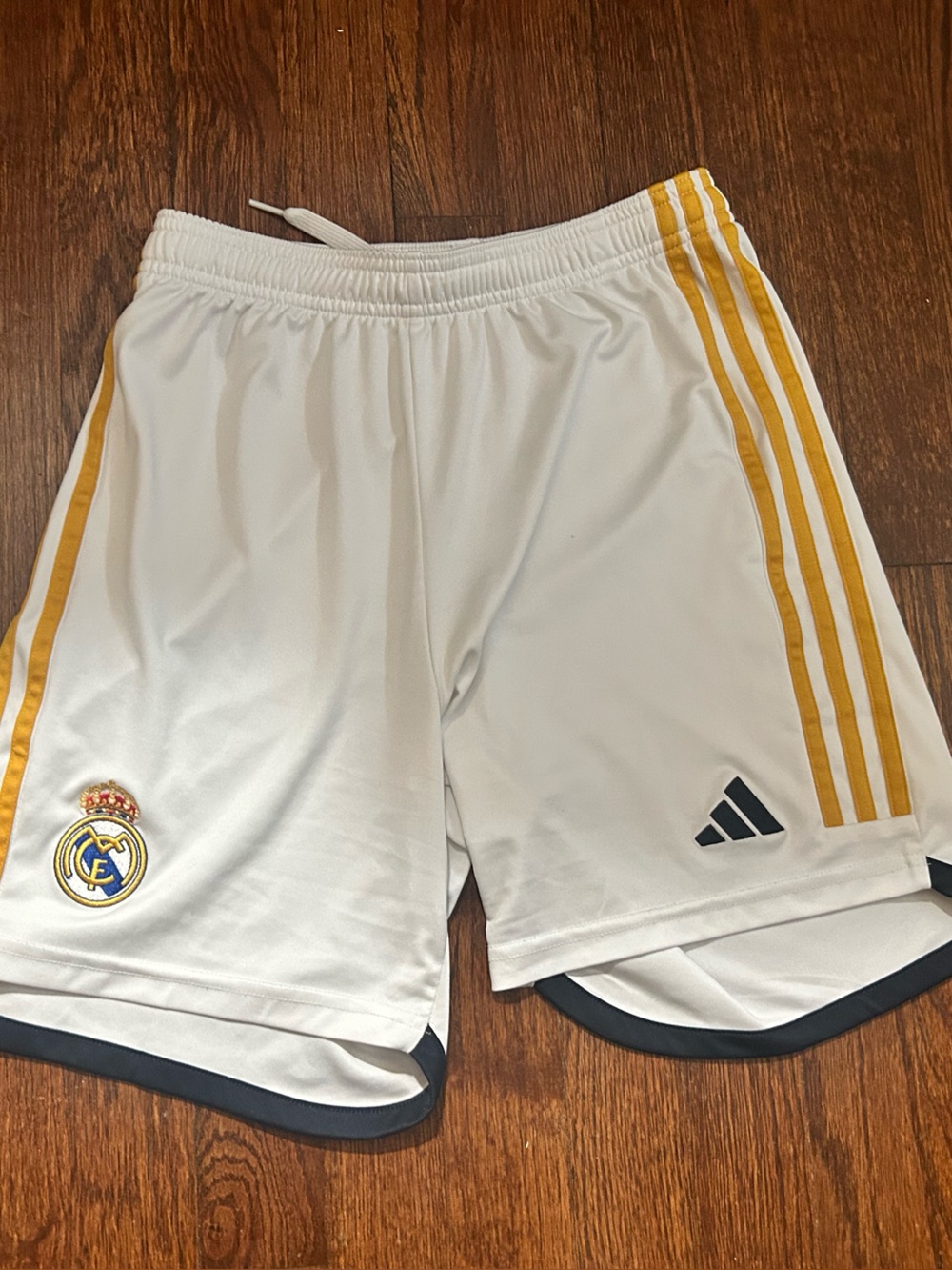 adidas White Athletic Shorts with Gold Accent Stripes Real Madrid soccer shorts